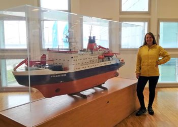 Maria Gomes at AWI in front of the model of the RV Polarstern